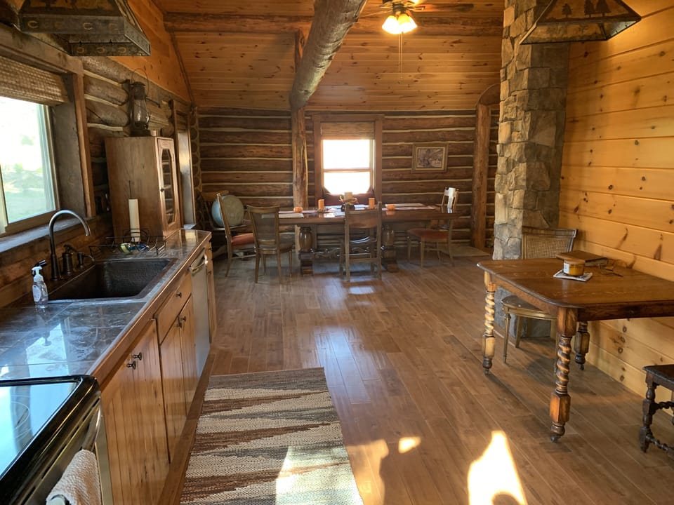 Very large kitchen with a dishwasher, microwave, stove/oven and refrigerator. 