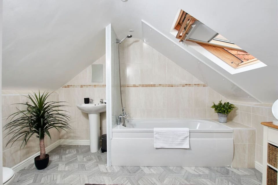 Bright and modern bathroom with shower and tub