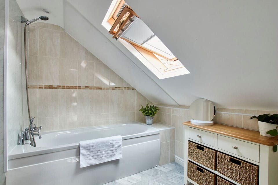 Bright and modern bathroom with tub and shower