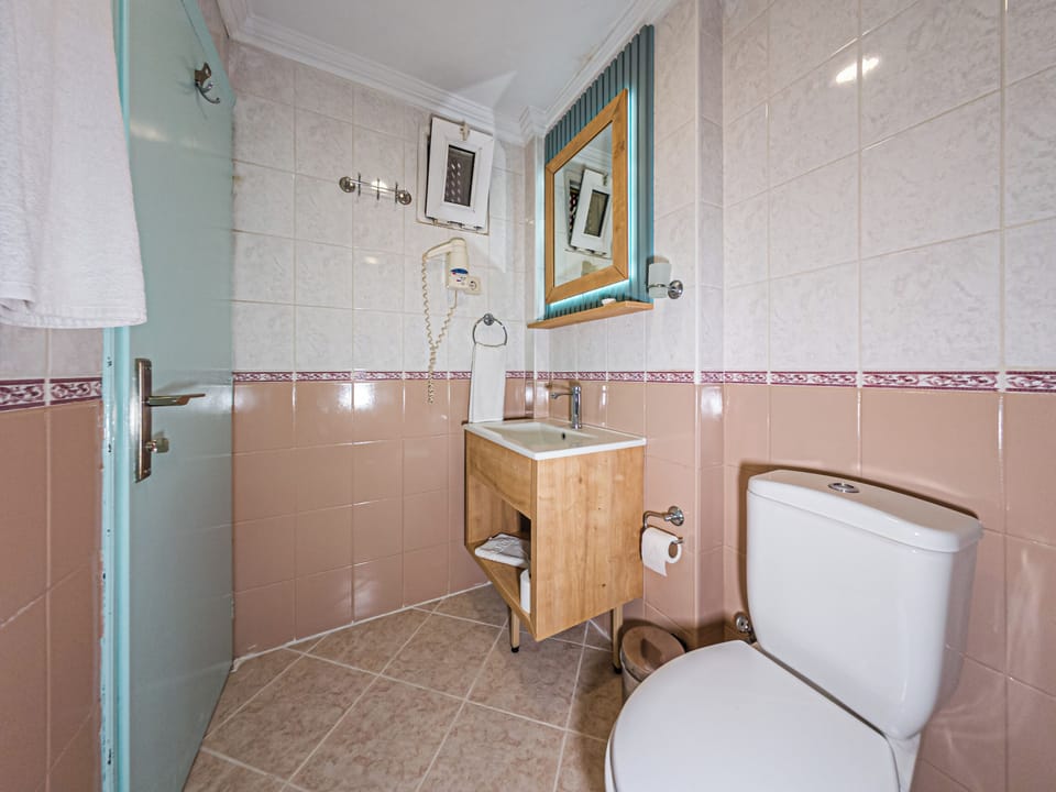 Shower, free toiletries, hair dryer, slippers