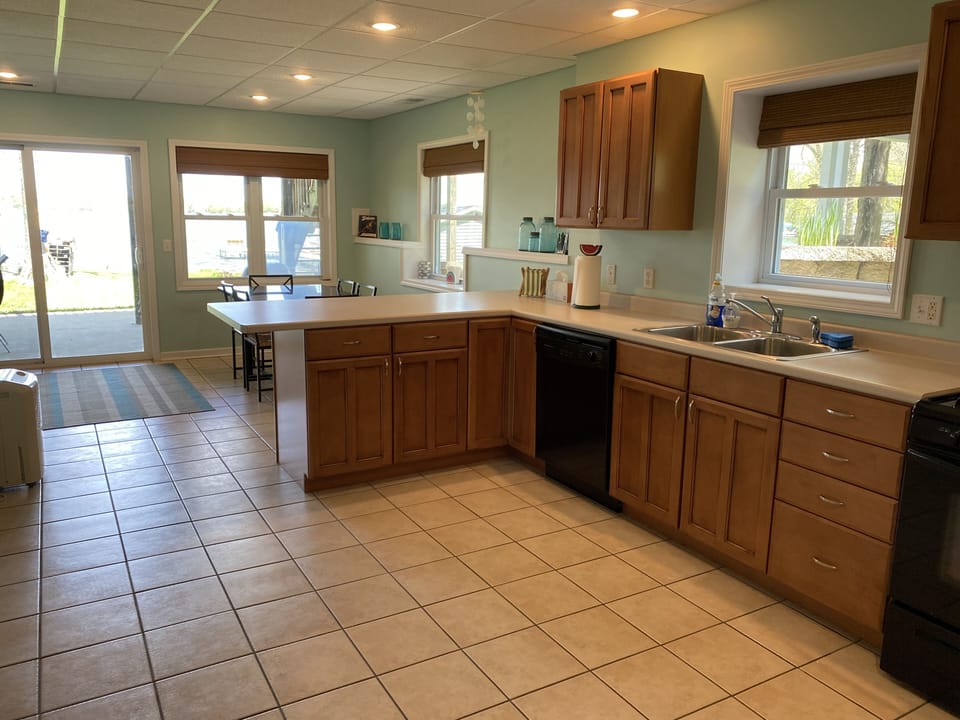 Lower level kitchen. Stove, oven, microwave, dishwasher, refrigerator/freezer