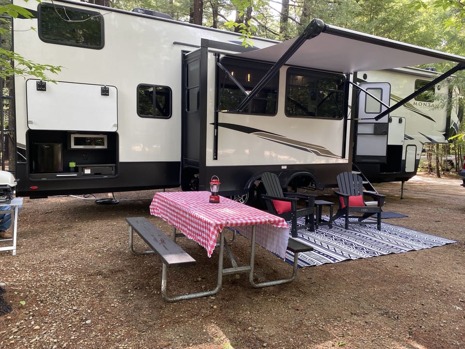  outside kitchen, grill, adirondack chairs, picnic table and fire pit