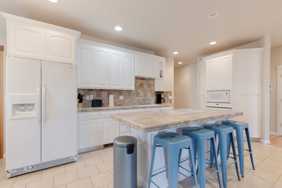 Large island and roomy kitchen perfect for preparing home cooked meals.