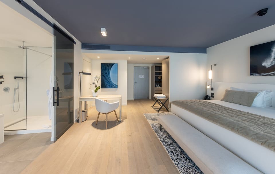 Suite, 1 King Bed, Pool Access | Minibar, in-room safe, laptop workspace, soundproofing