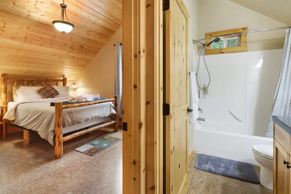 Full bathroom with tub next to the bedroom upstairs (now upgraded to a King bed!)