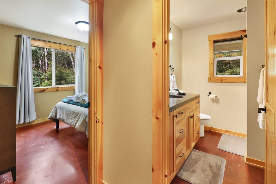 Full bath with shower on the ground floor right next to the main floor bedroom with king sized bed