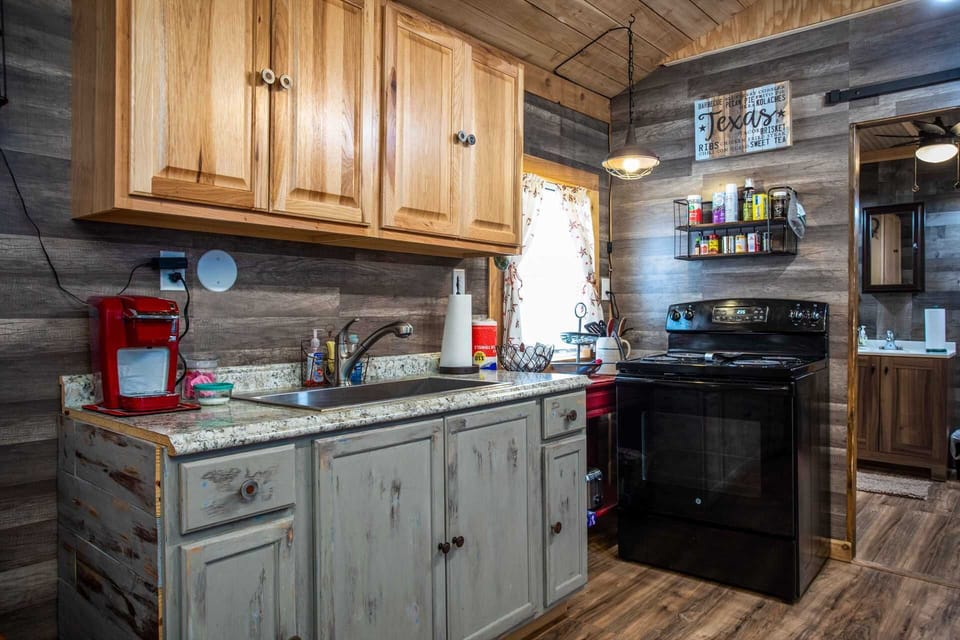 A convenient stove and large sink fill out the useful space in the cabin's full kitchen!
