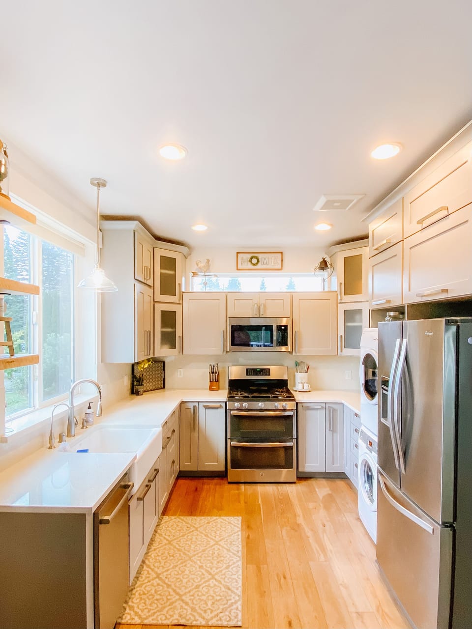 Kitchen with double gas oven and stacking washer/dryer
