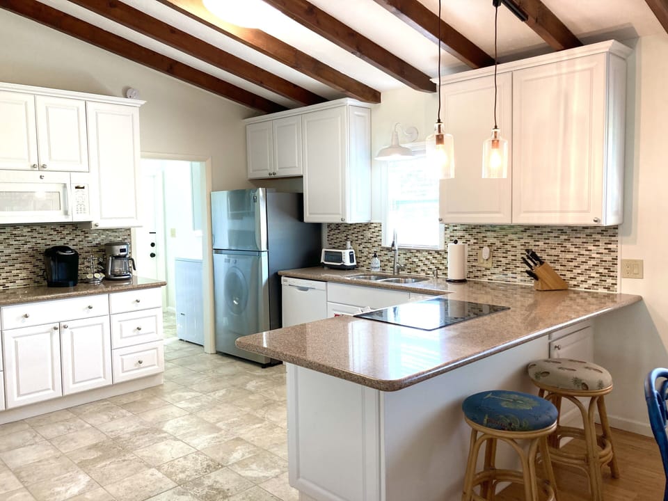 Well equipped kitchen with plenty of cabinet and pantry space for your items