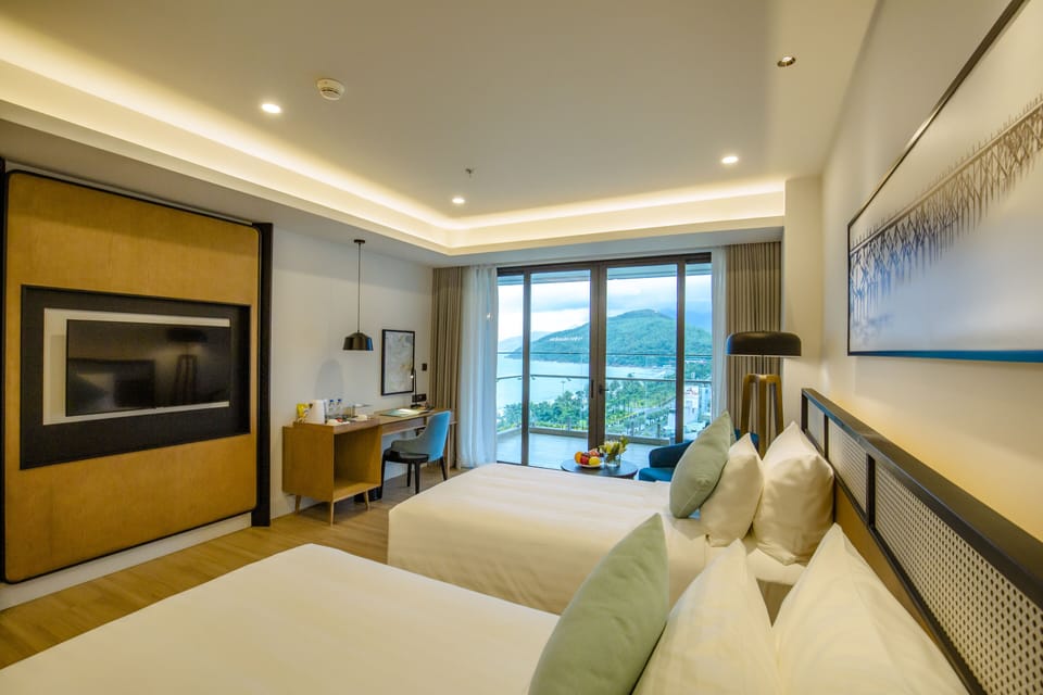 Deluxe Twin Room, Sea View | Minibar, in-room safe, desk, laptop workspace