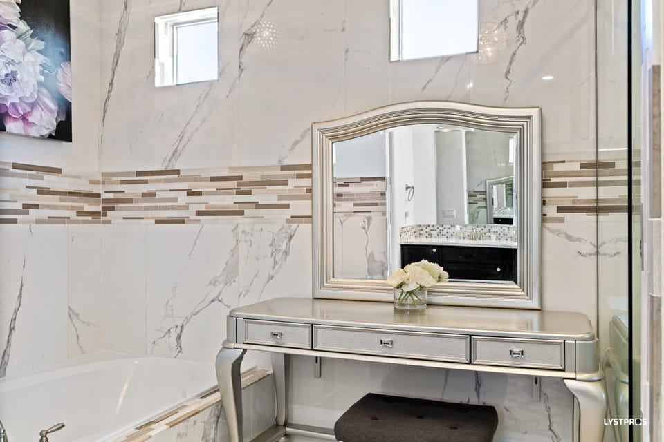 Vanity and soaking tub in master bathroom