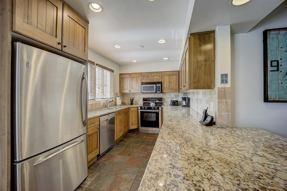 Huge kitchen with beautiful and new appliances.