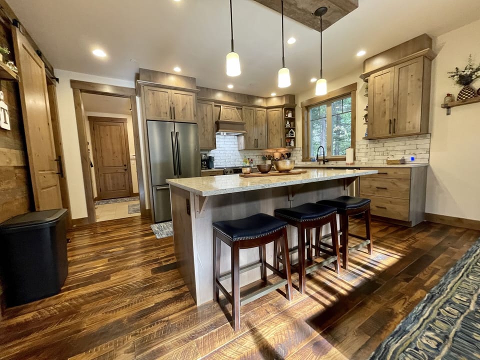 The kitchen cabinets are full of everything you need to feed your group of 12. 