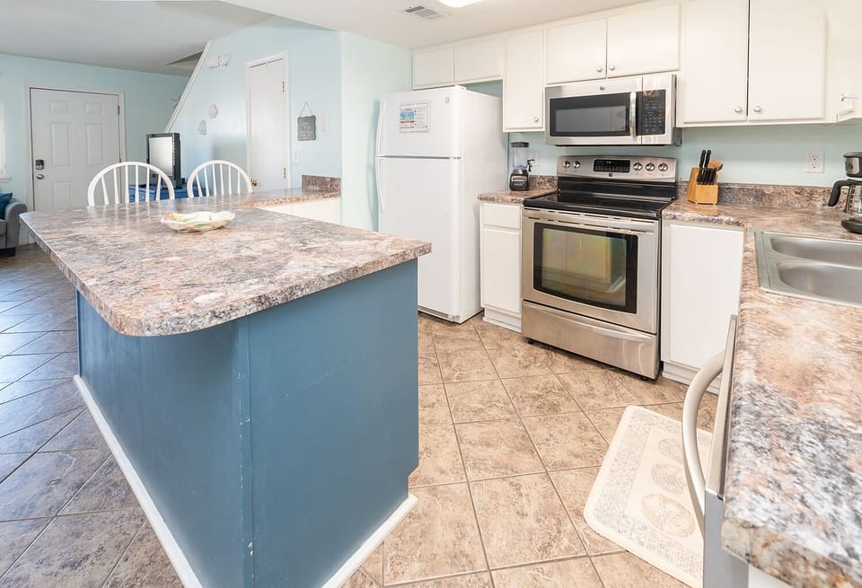 kithcen is certainly large enough for more than one cook at a time.