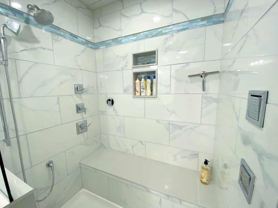 Upper level shared bathroom with luxury steam shower