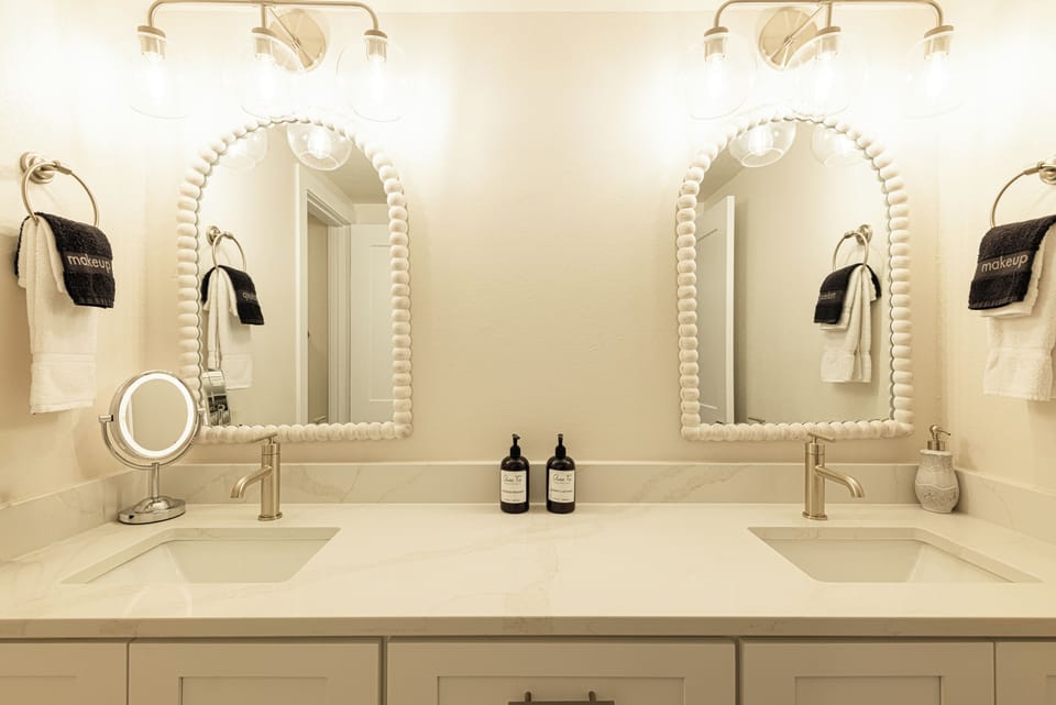 Hall bathroom with dual-sink vanity
