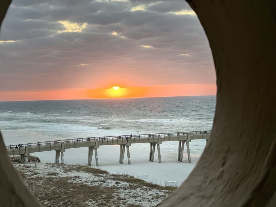 View from Balcony . . . Always fun to look thru porthole.