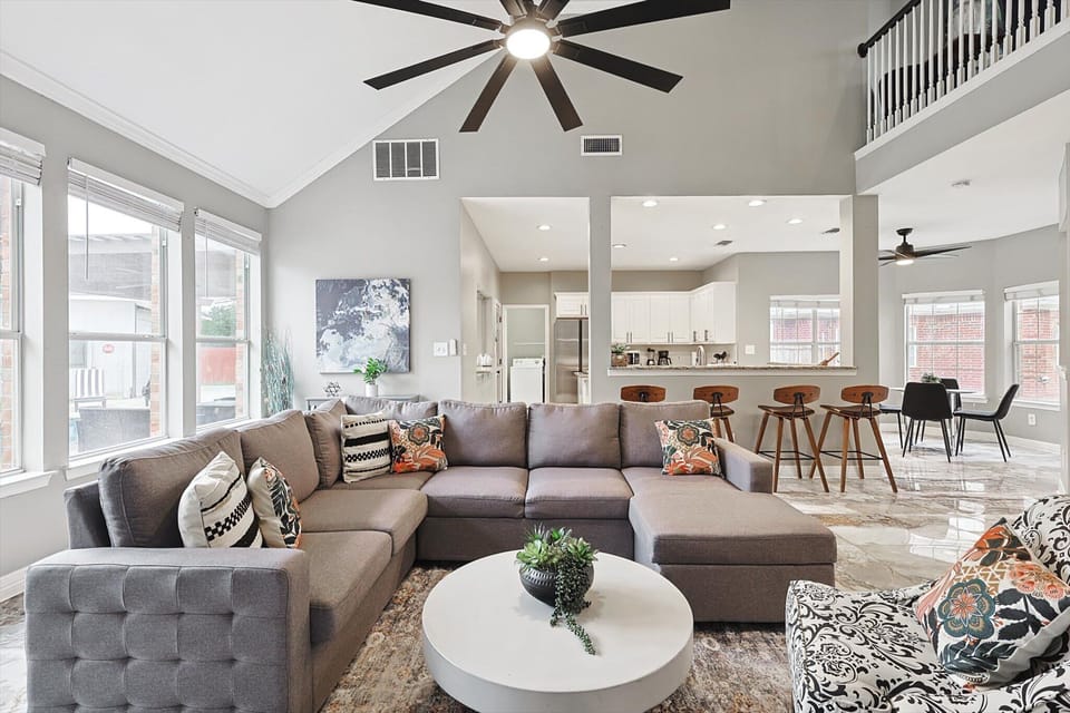 Modern Lounge Area with Cozy Seating & Seamless Kitchen Connection