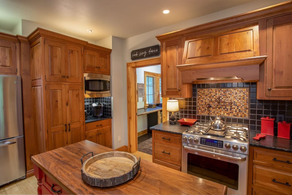 Kitchen with Custom Island and Stainless Oven with Gas Cooktop and Pot Filler!