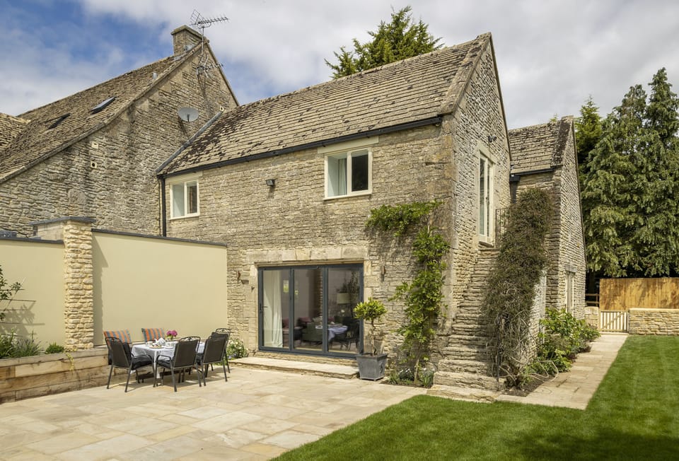 South facing rear walled garden with large terrace and garden furniture
