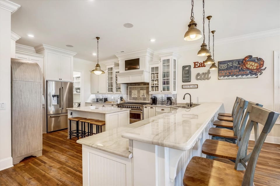 The kitchen island provides additional counter space for serving snacks or meals