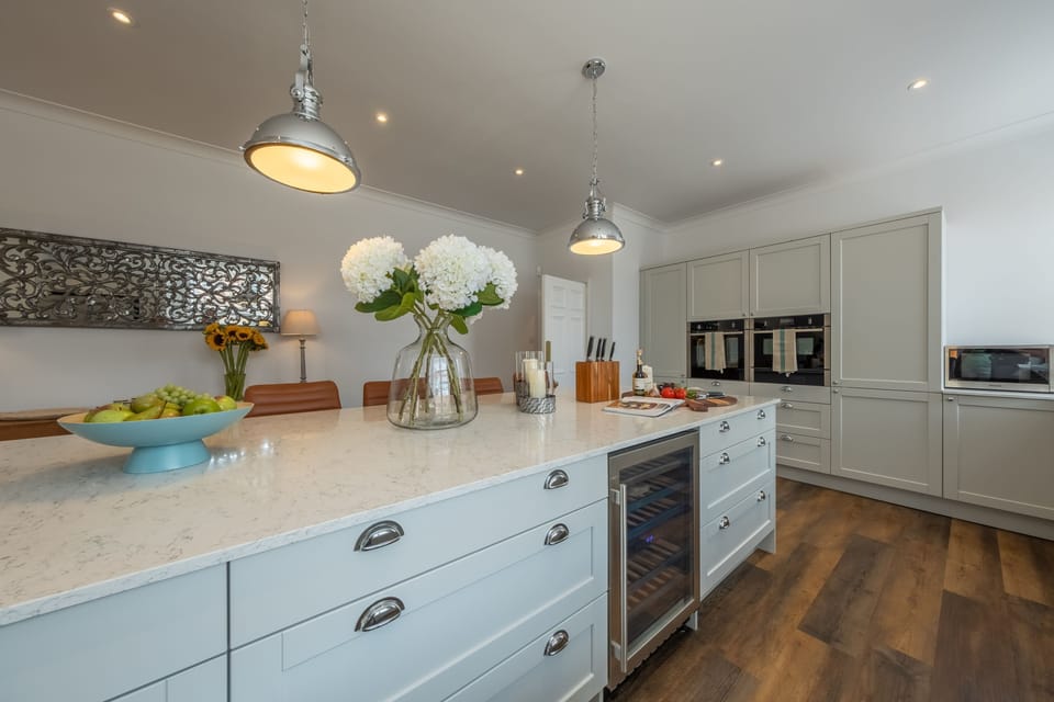 Ground floor: Modern, well-equipped kitchen featuring a double oven