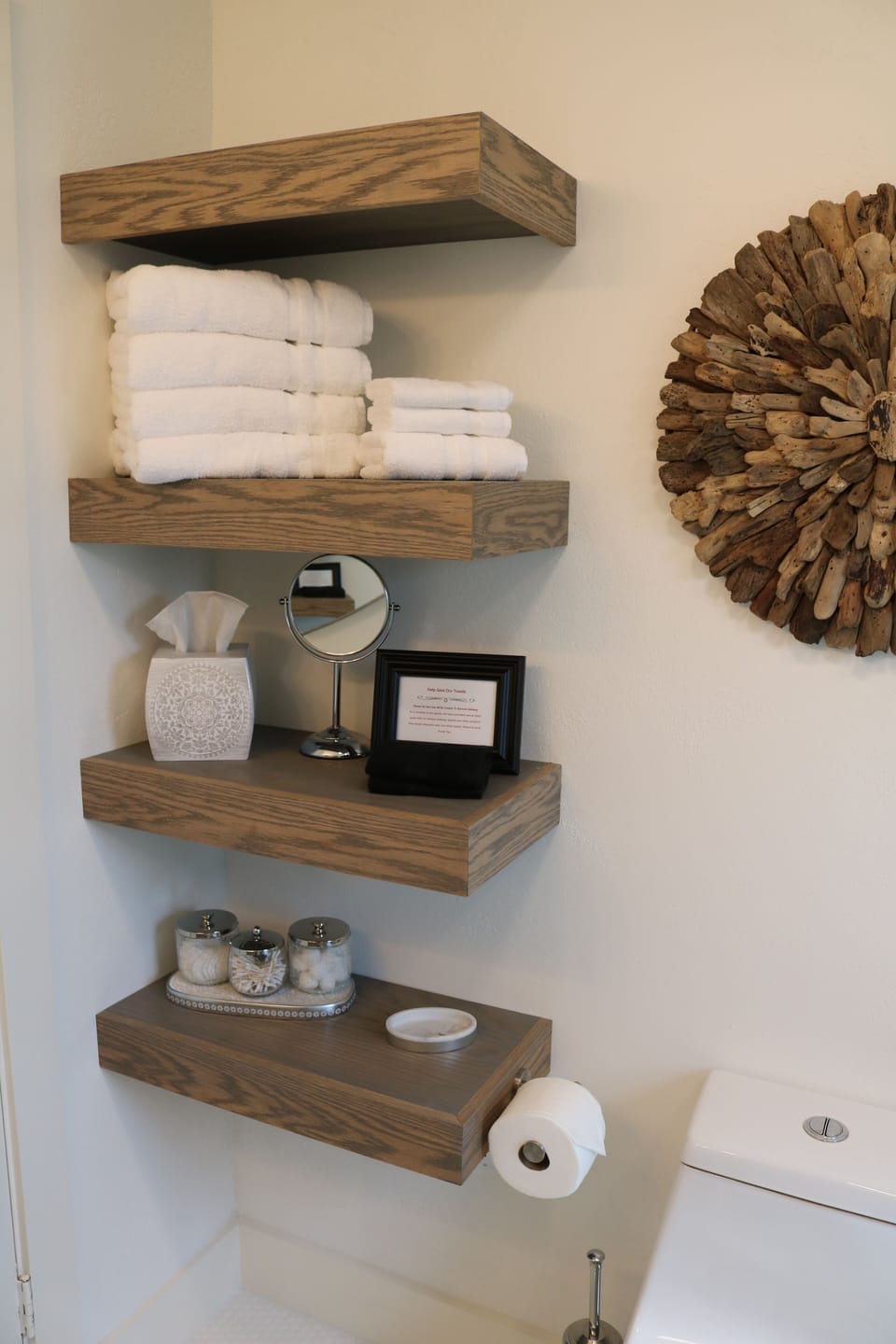 Luxurious bath linens, vanity mirror and other complimentary items for guest use