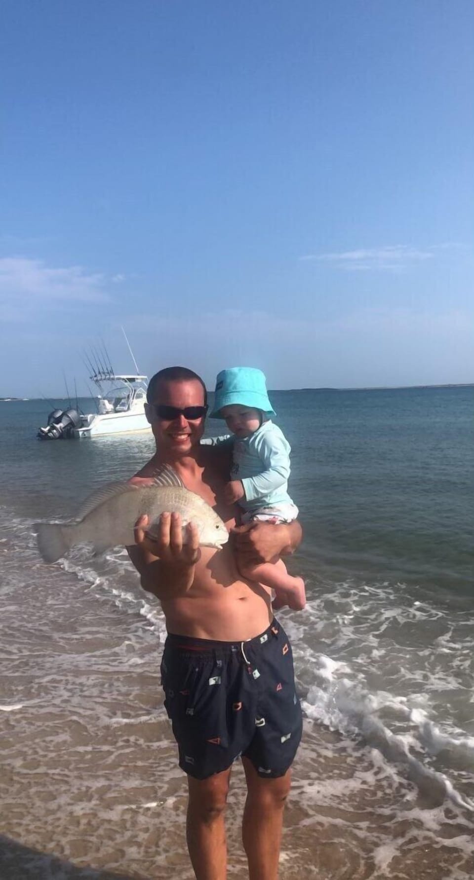 Finley and Dad catching fish