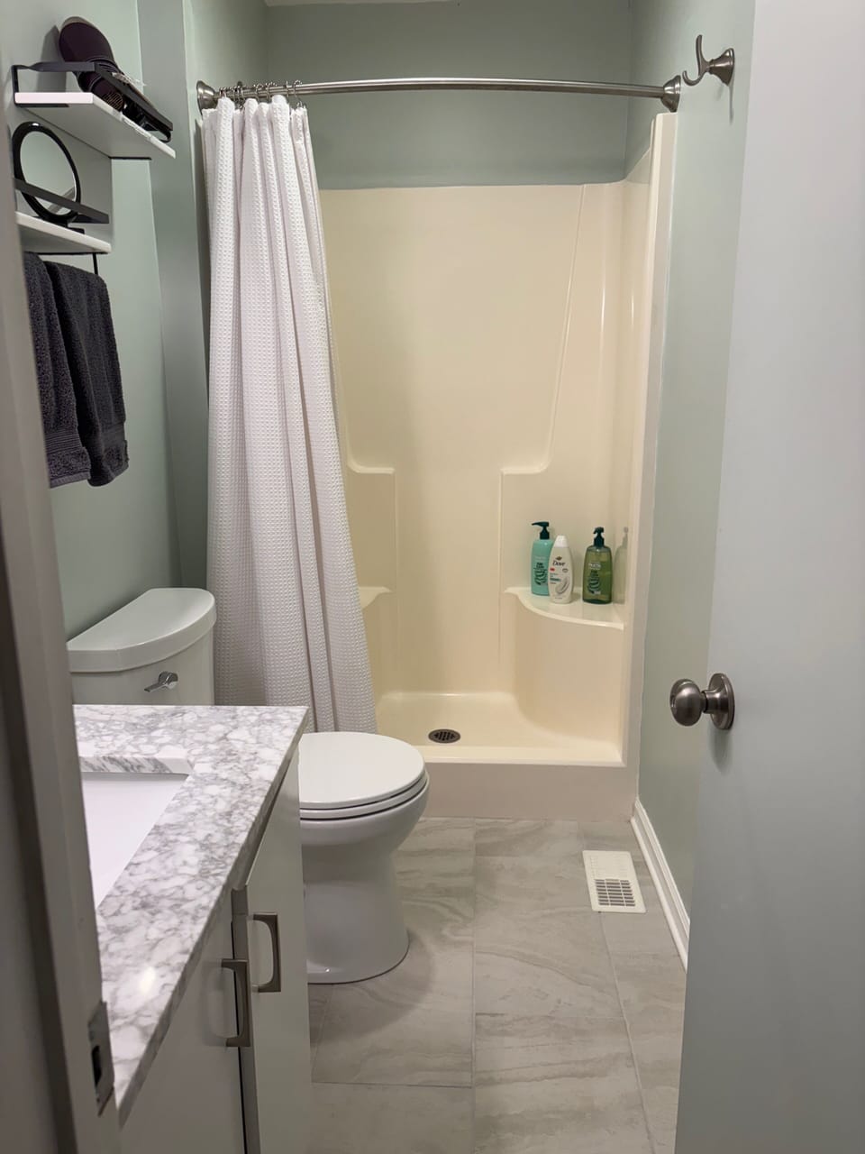 New tile flooring in primary ensuite bath (10/25) Low threshold entry to shower