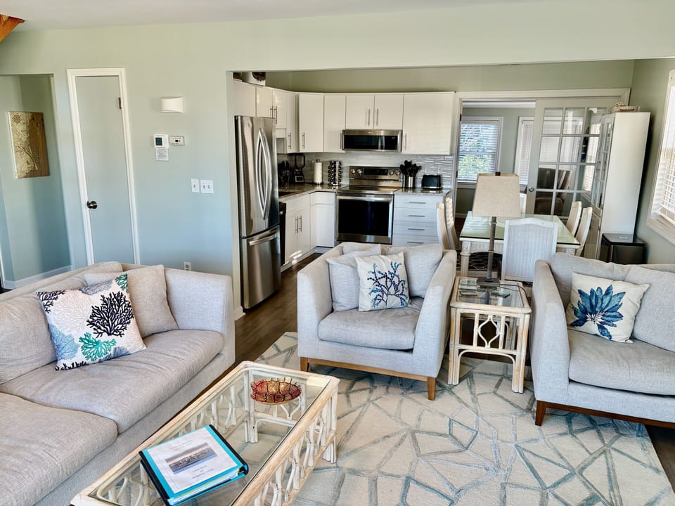 Open concept design with living room, dining, and kitchen. Sunroom off kitchen.