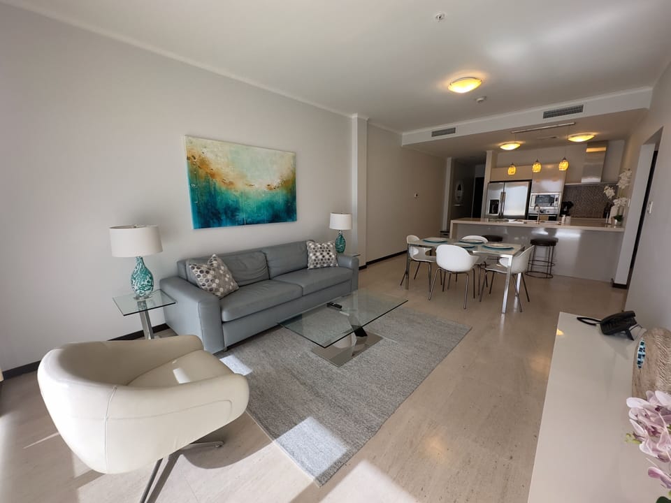Spacious Living Room with 65 Inch Smart TV