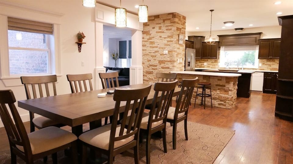 Dining open to kitchen, table expands to seat 10