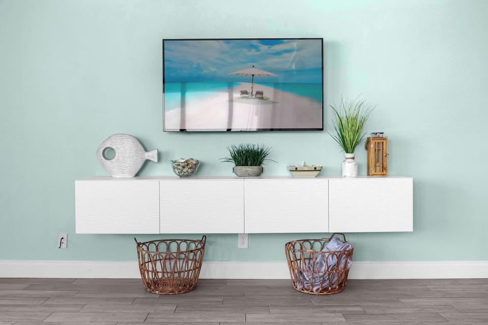 Relax with stylish decor and a stunning view of paradise on the TV!