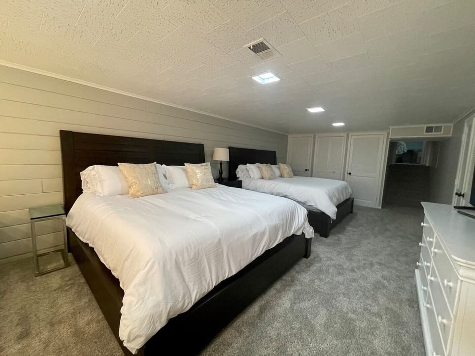 Two King beds, two vanity stations, 55” Smart TV
