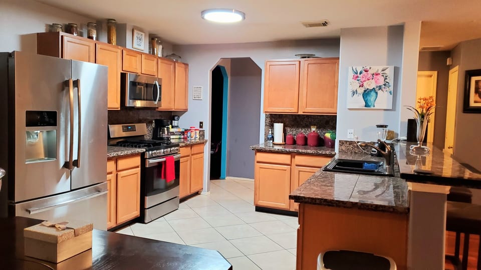Fully stocked kitchen with top of the line appliances. 