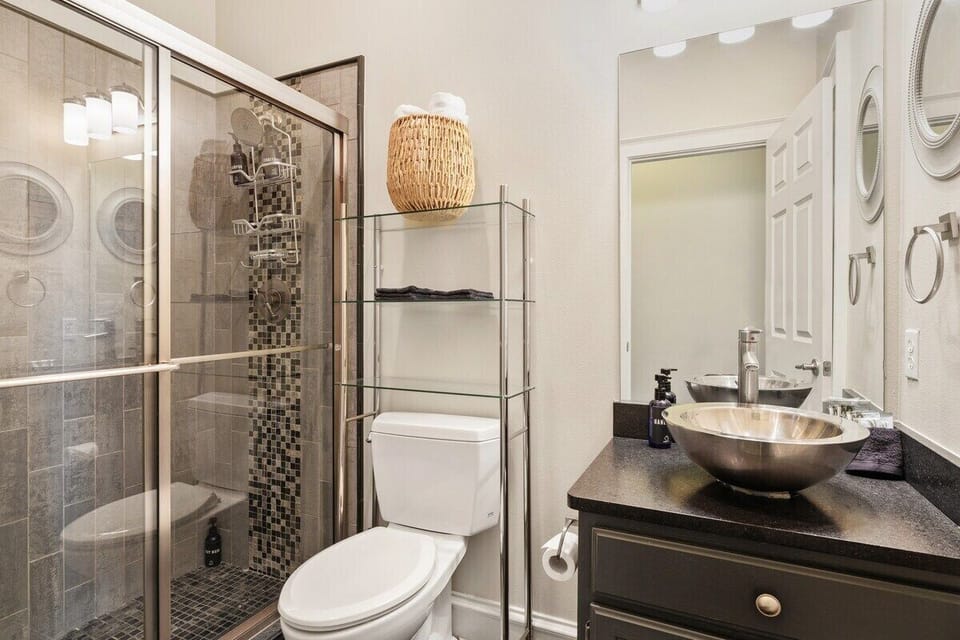 Hall bathroom with a tiled shower.