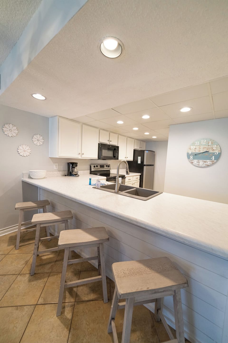 Don't leave the chef all alone in the kitchen, sit here and chat.
