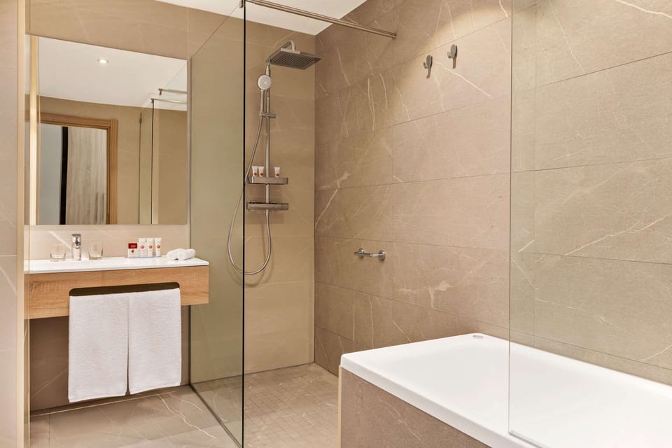 Executive Suite, 1 King Bed, Non Smoking | Bathroom | Eco-friendly toiletries, hair dryer, bathrobes, slippers