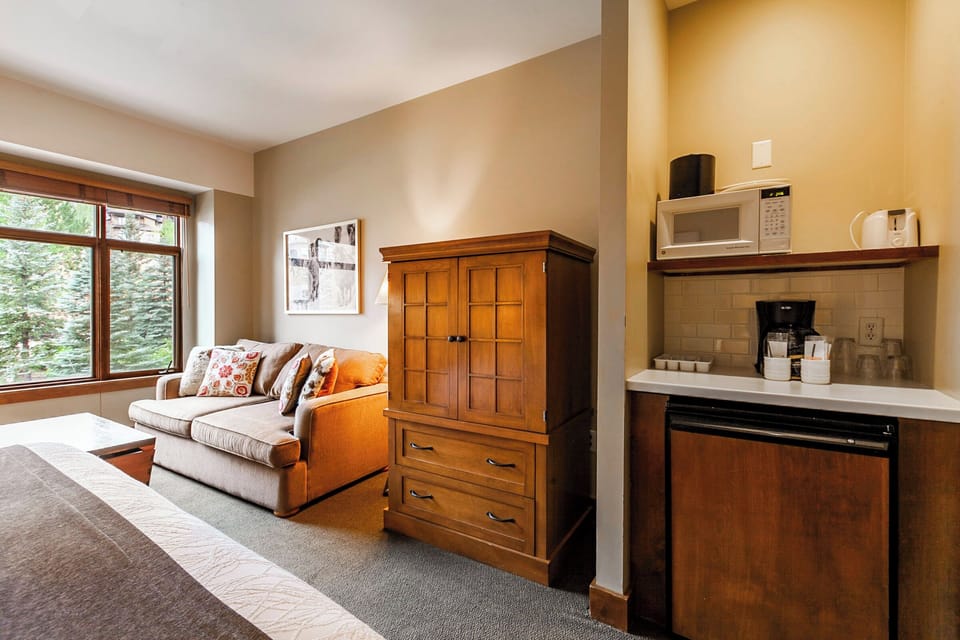 Primary Bedroom with Mini Fridge, Microwave, and Coffee Maker