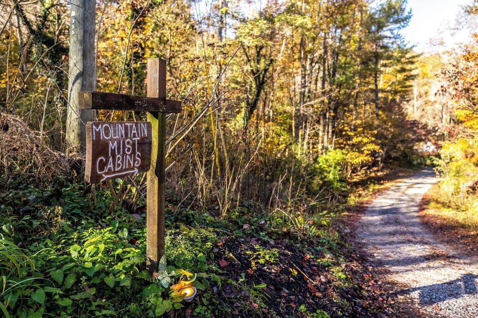 "Mountain Mist Cabins" sign located at the driveway from the main road. Turn just before the sign!