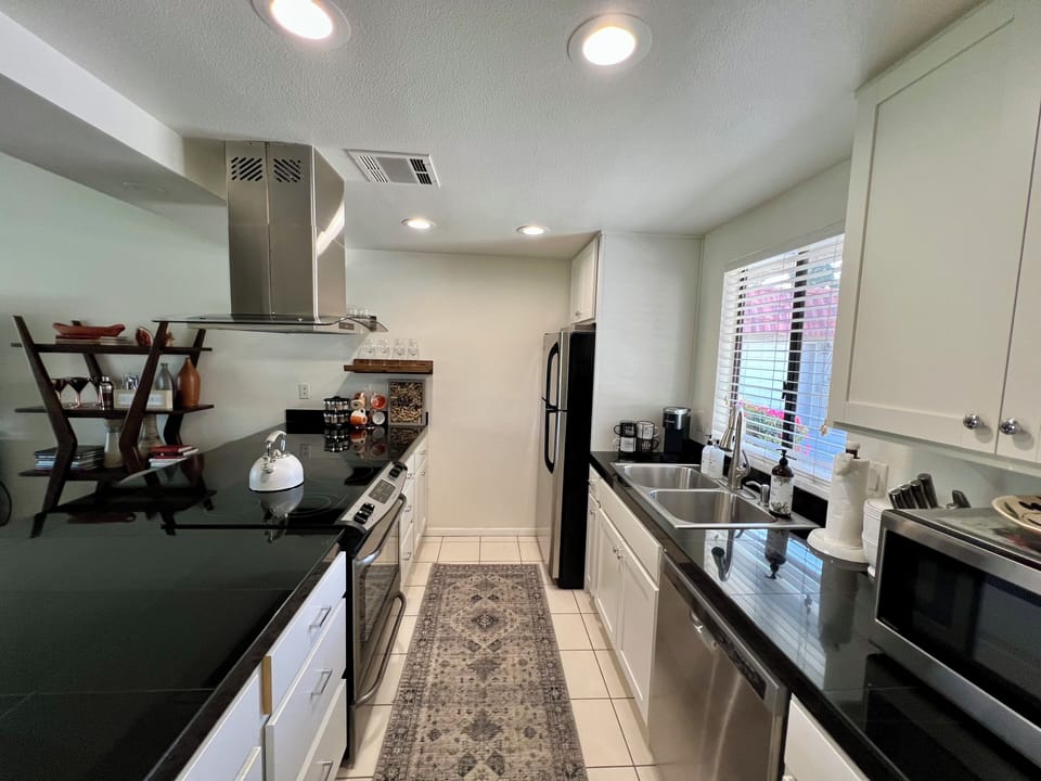 Kitchen with black granite counter and lots of amenities