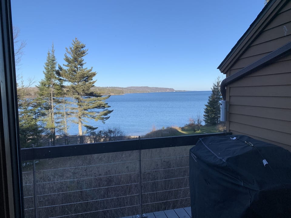 Deck with grill over looking the bay.