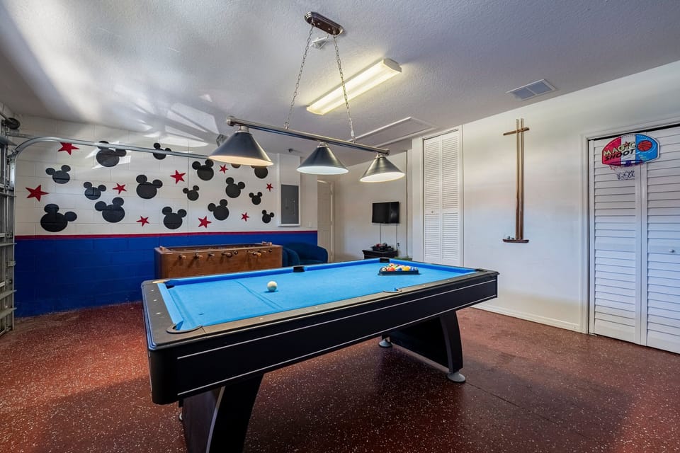 Game room showing pool table and foosball.