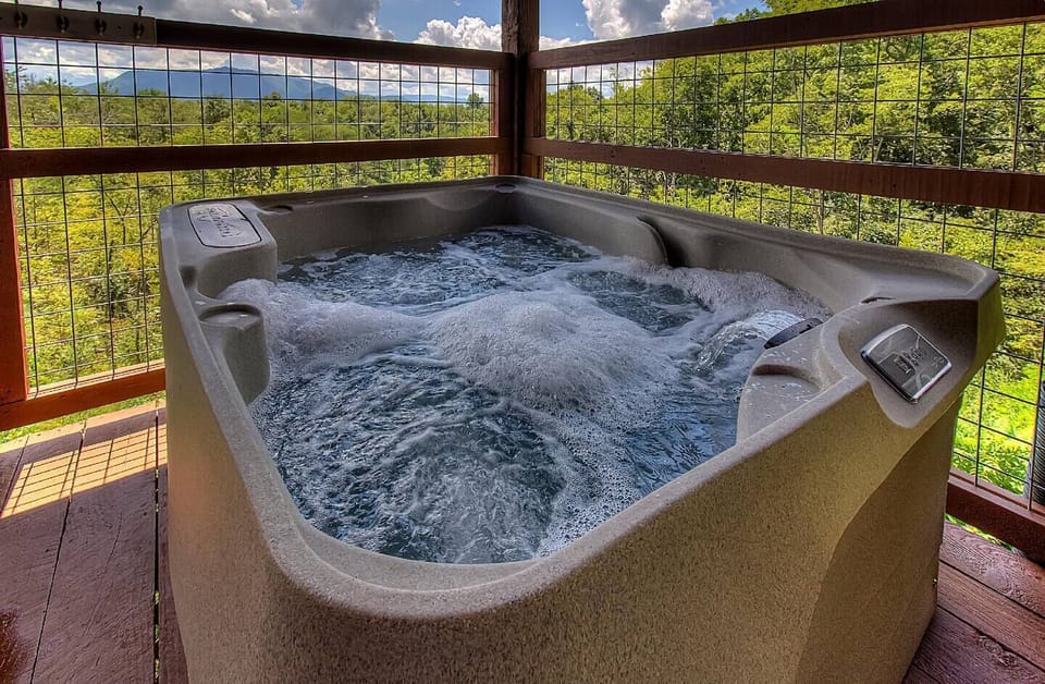 Enjoy the view from the hot tub under the covered deck (4-5 person hot tub)