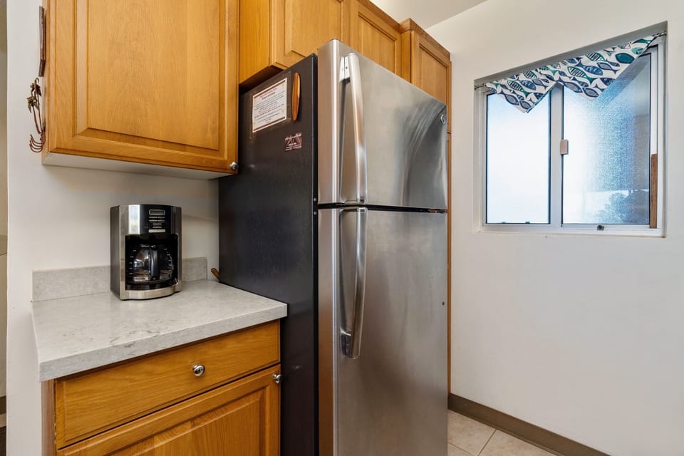 The kitchen features a drip coffeemaker and some coffee to get the trip started.