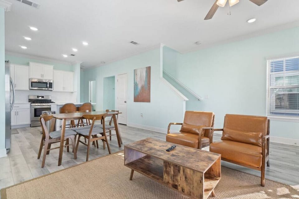 Open concept living area with 70 inch smart TV ready for all streaming stations (with your own login) such as Netflix, Disney+, Amazon Prime, etc. High speed internet.Real plants add a beachy feel.