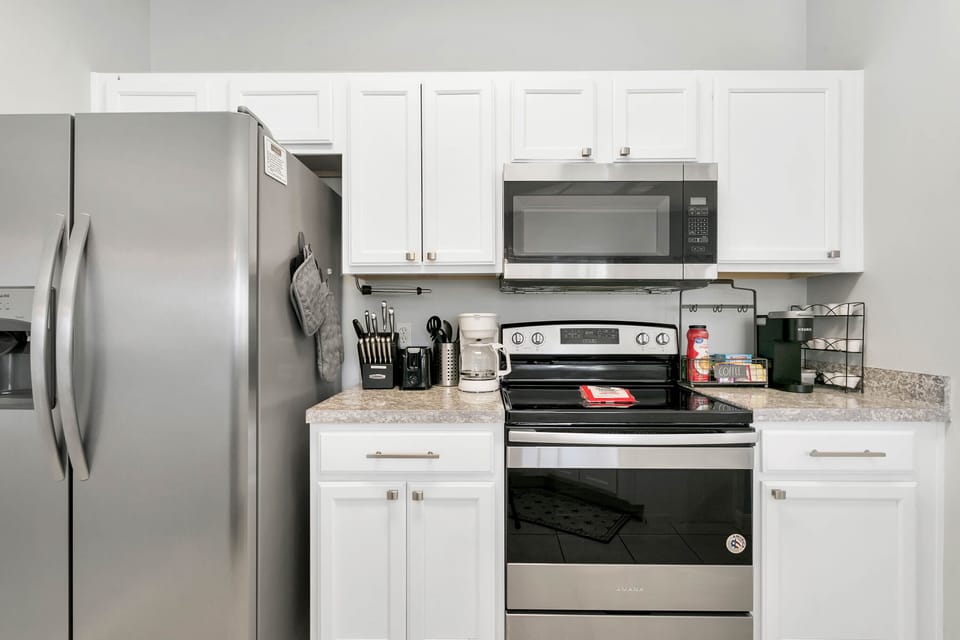 kitchen with Keurig coffee maker, regular coffee pot,  and tea kettle