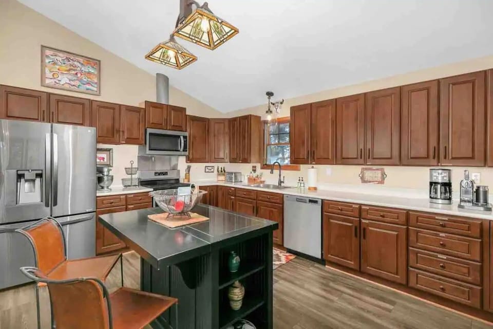 The kitchen island provides an additional seating for two.