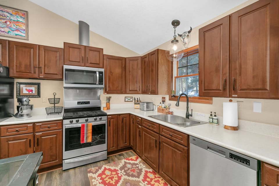 The kitchen is fully equipped with all dining and cooking necessities.