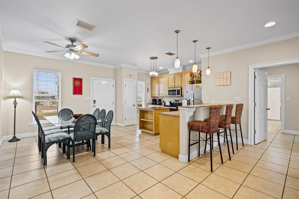 Off The Hook Kitchen with Bar Seating and Dining Table